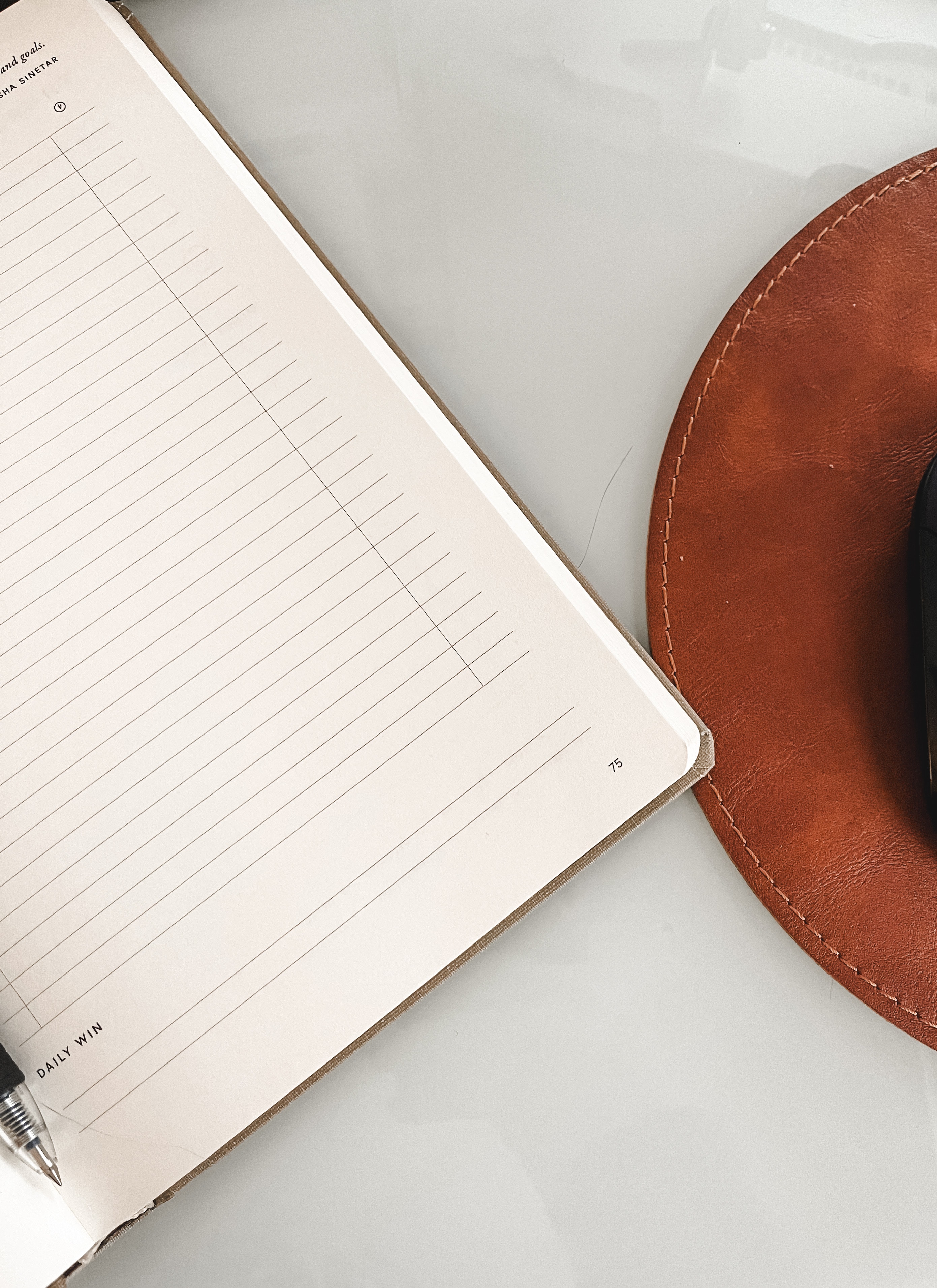 white notebook sitting on desk