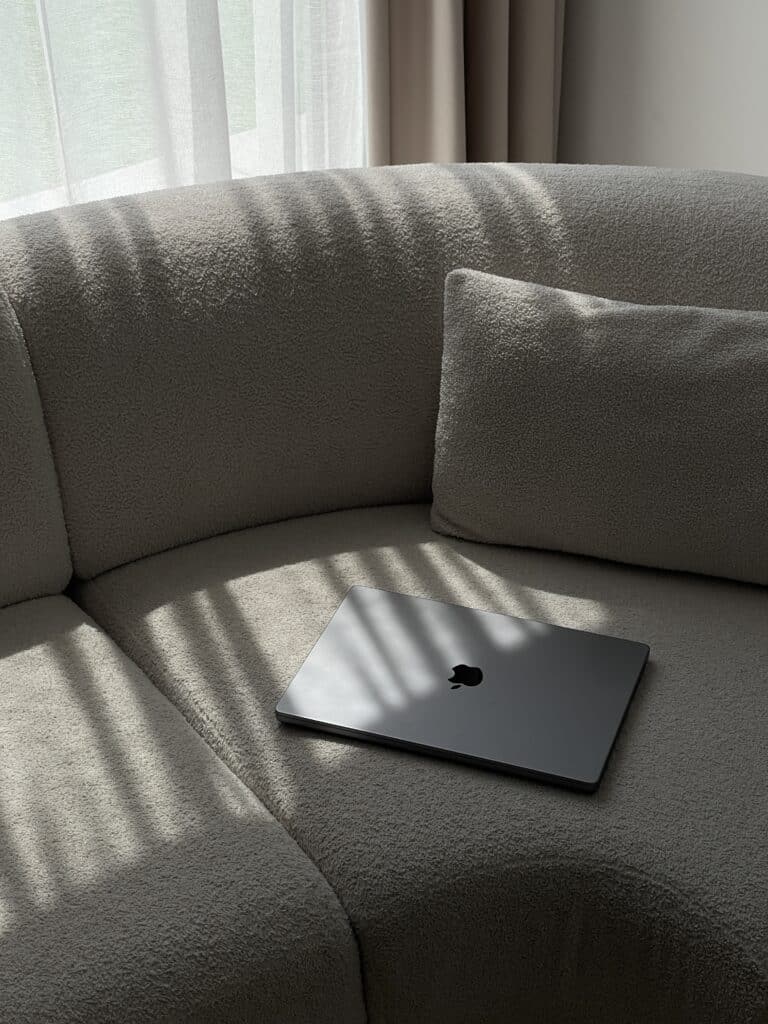 computer sitting on a couch