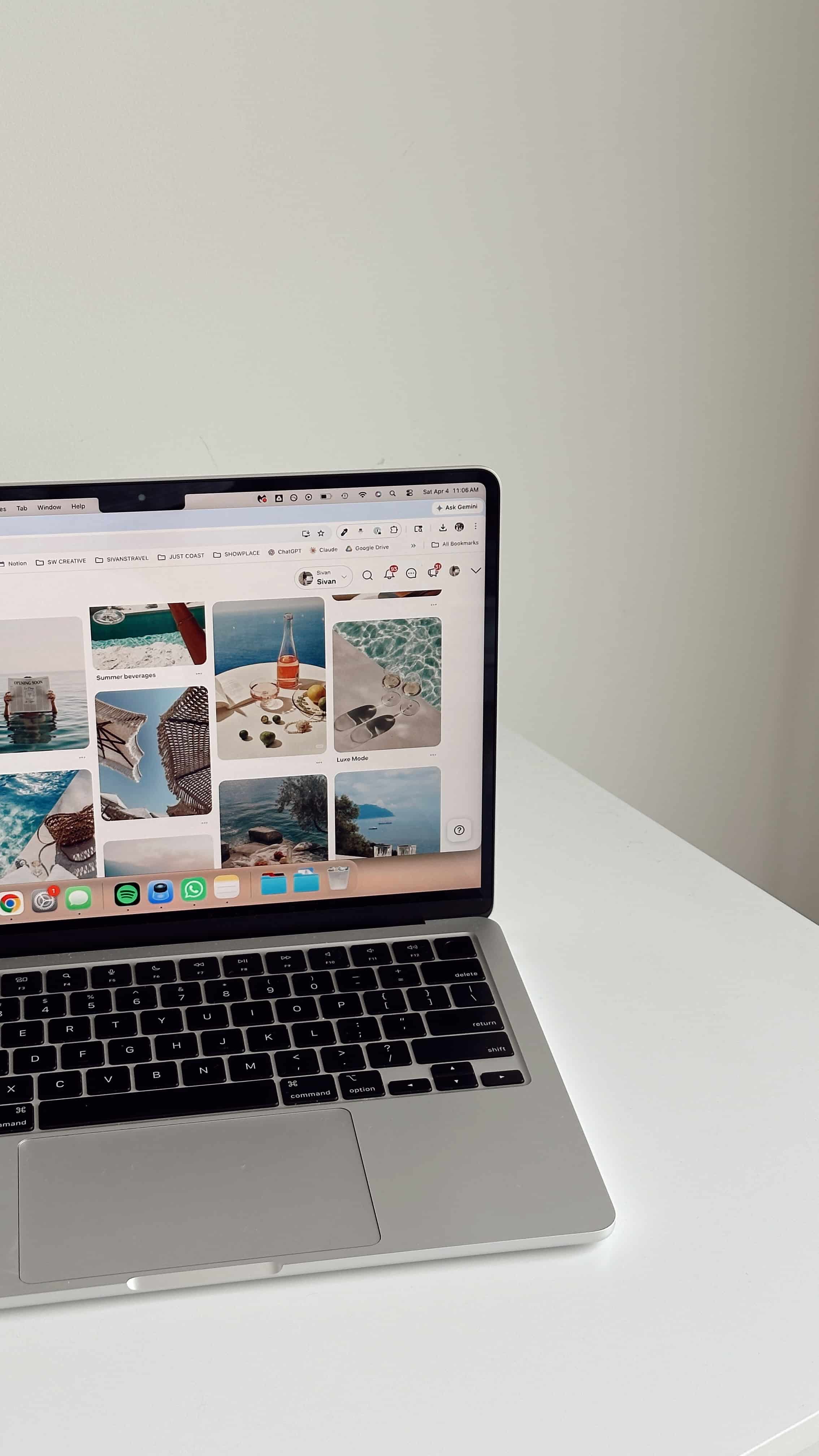 Sleek laptop on white table showing Pinterest-style board for SEO for therapists, including sunny beach photos