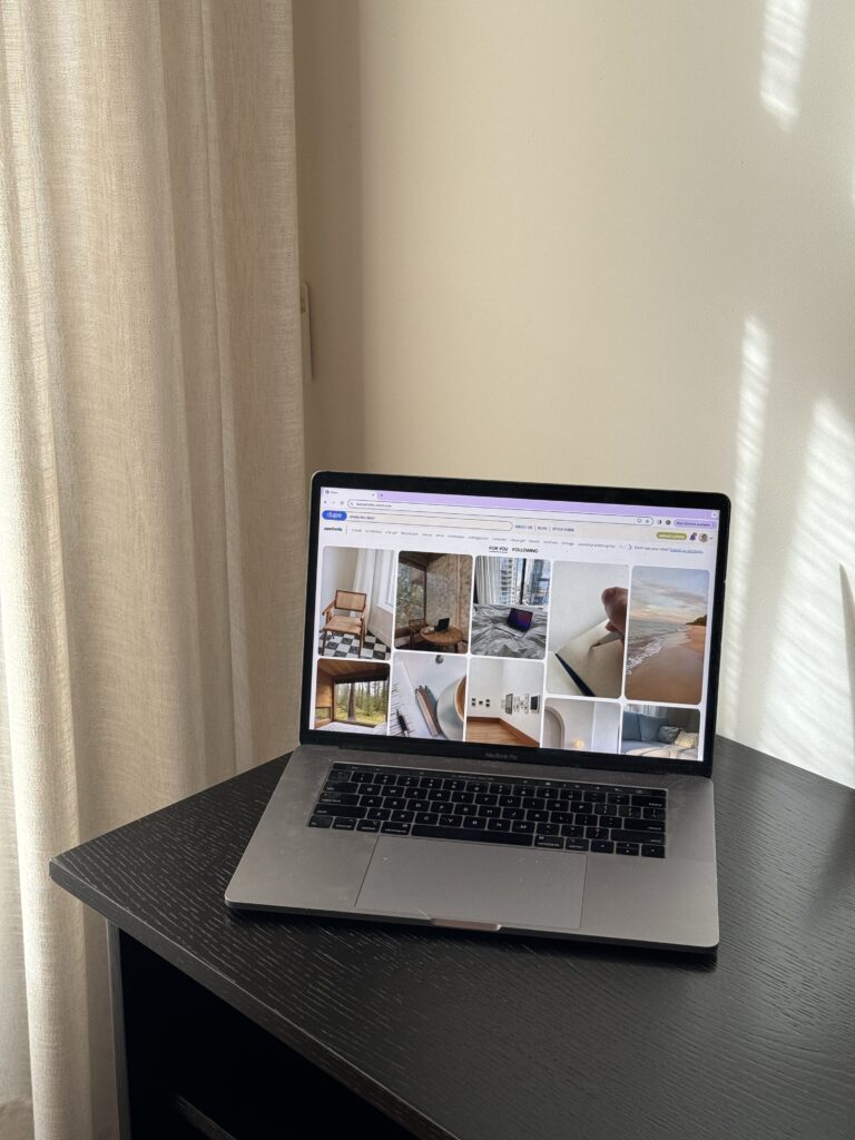 This workspace features a computer on a desk against a neutral wall, a great place to research seo mistakes to avoid.