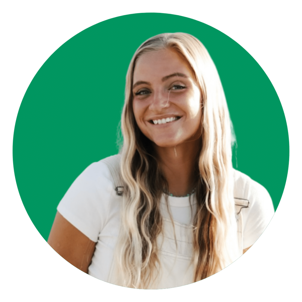 Smiling woman with long blonde hair in a white shirt, portrait against a green circular background.