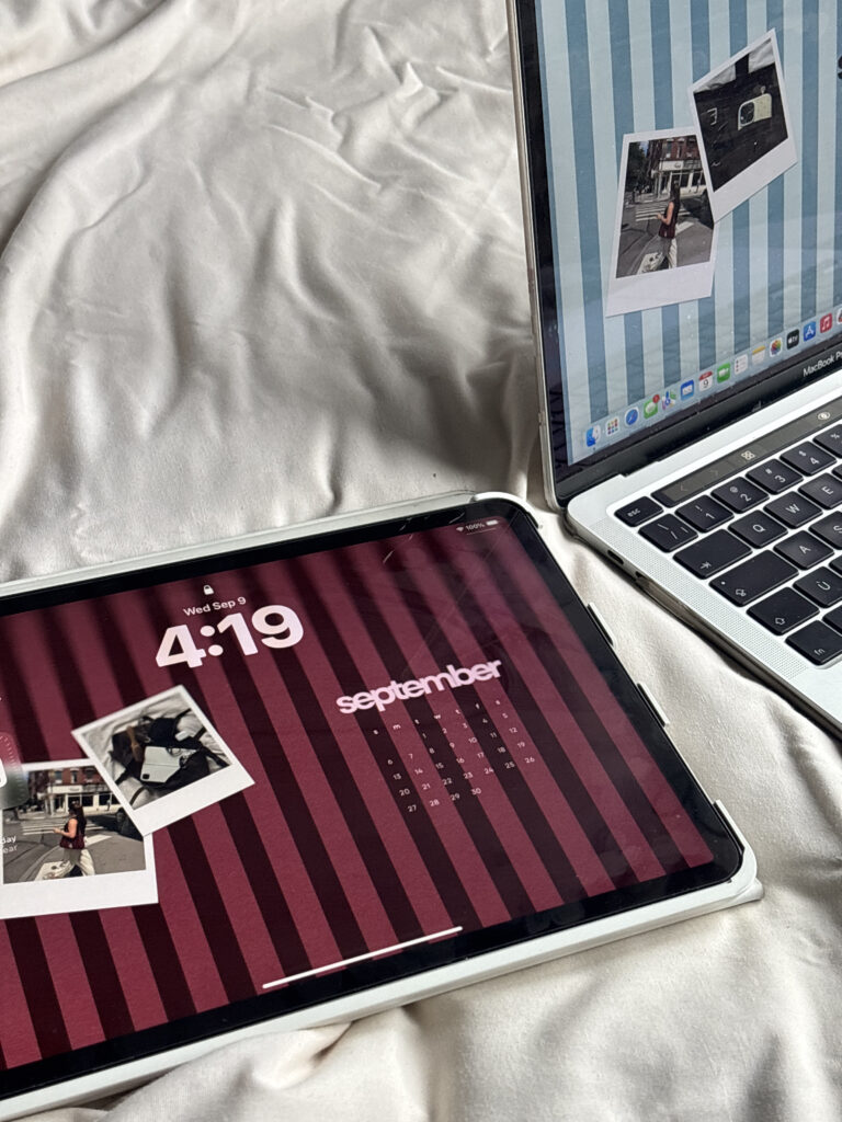 iPad and laptop displaying photos on a white comforter, with SEO tips for small businesses in mind