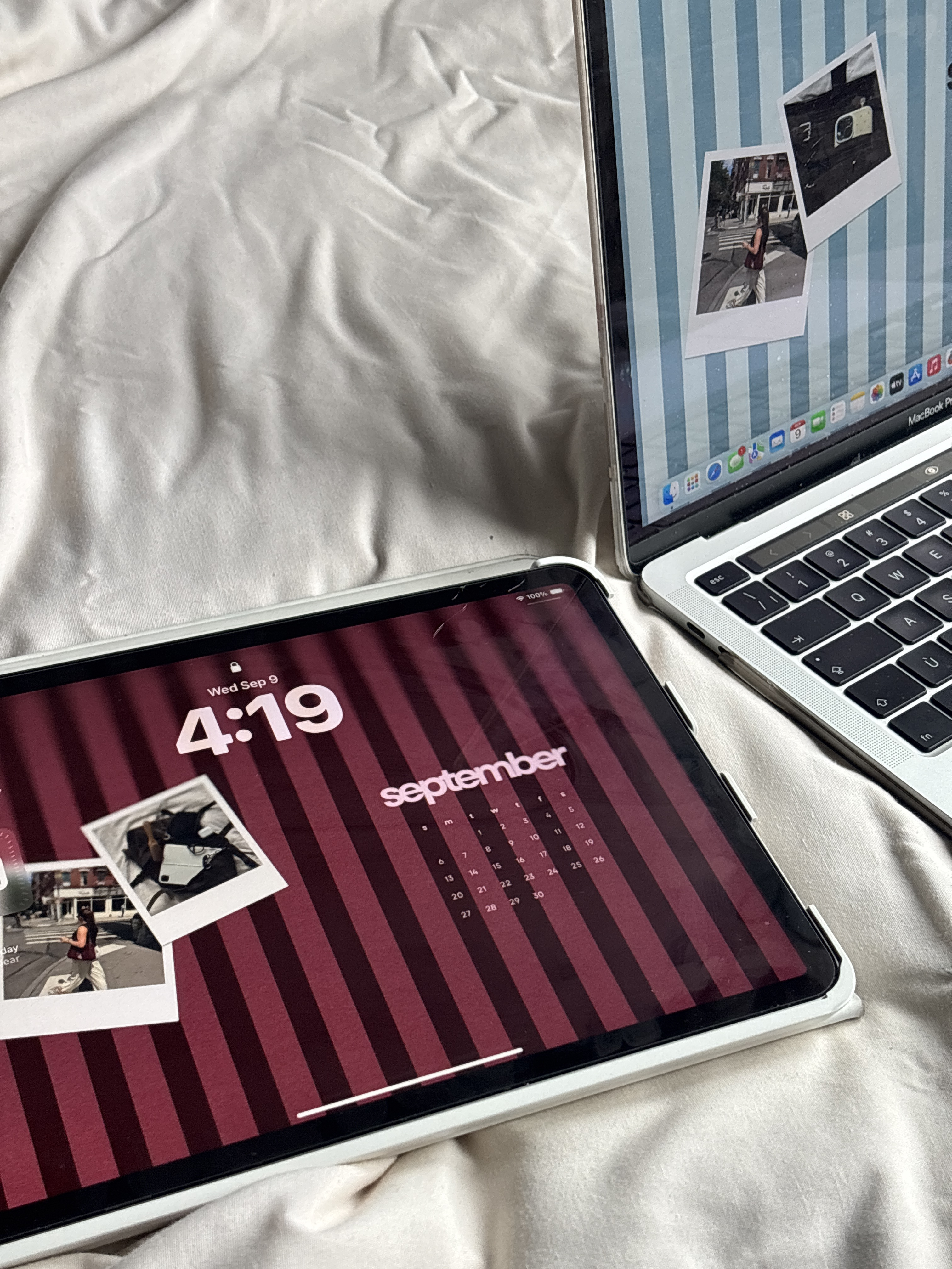iPad and laptop displaying photos on a white comforter, with SEO tips for small businesses in mind
